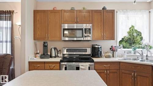 50 Snowbird Crescent, Leduc, AB - Indoor Photo Showing Kitchen With Double Sink