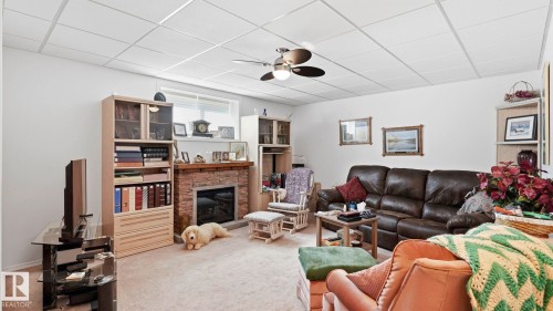50 Snowbird Crescent, Leduc, AB - Indoor Photo Showing Living Room With Fireplace