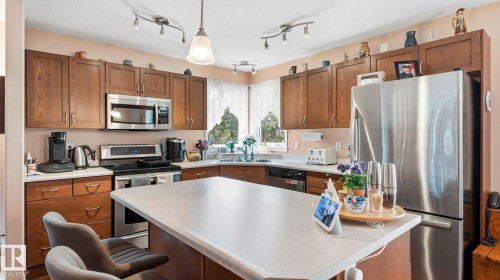 50 Snowbird Crescent, Leduc, AB - Indoor Photo Showing Kitchen With Double Sink