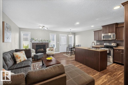 5110 168A Avenue Nw, Edmonton, AB - Indoor Photo Showing Other Room With Fireplace