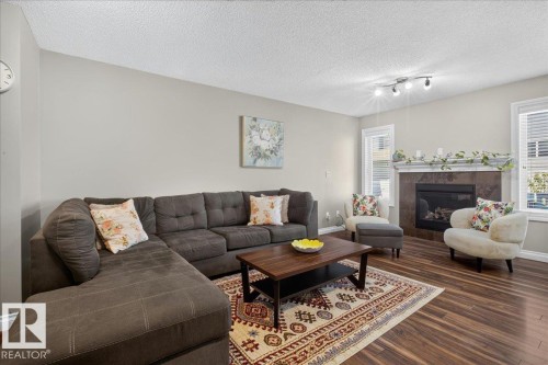 5110 168A Avenue Nw, Edmonton, AB - Indoor Photo Showing Living Room With Fireplace