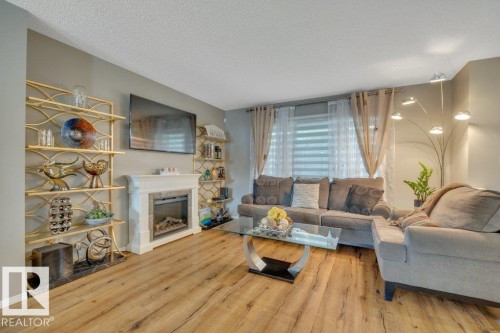 723 Secord Boulevard Nw, Edmonton, AB - Indoor Photo Showing Living Room With Fireplace