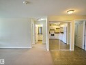 Open-concept living space with carpeted flooring - #111 5350 199 St Nw, Edmonton, AB  - Indoor Photo Showing Other Room 