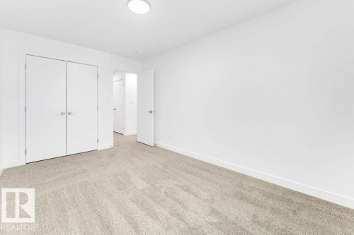 Recessed lighting, light-toned carpet, white walls, and white interior doors - 182 Pacific Drive, Spruce Grove, AB - Indoor Photo Showing Other Room