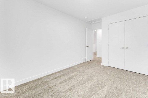 Neutral tone carpeting, white walls, and bright overhead lighting - 182 Pacific Drive, Spruce Grove, AB - Indoor Photo Showing Other Room