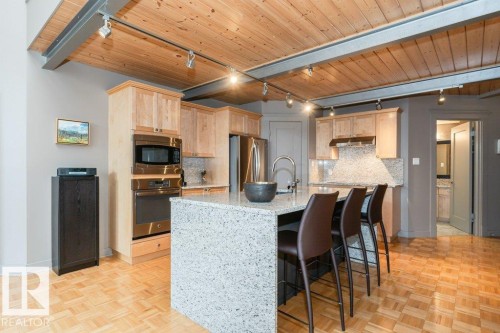 #203 10009 102 Av Nw, Edmonton, AB - Indoor Photo Showing Kitchen With Stainless Steel Kitchen