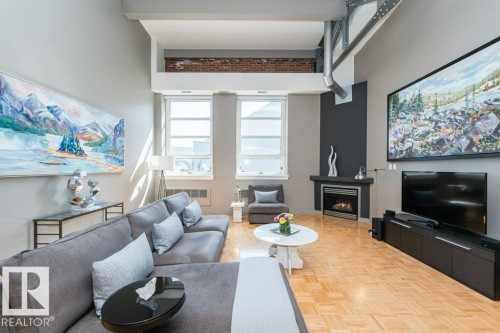 #203 10009 102 Av Nw, Edmonton, AB - Indoor Photo Showing Living Room With Fireplace
