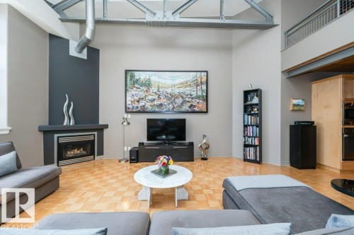 #203 10009 102 Av Nw, Edmonton, AB - Indoor Photo Showing Living Room With Fireplace