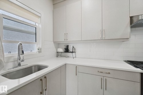 Stainless steel undermount sink with a gooseneck faucet - 4820 174 Avenue Nw, Edmonton, AB - Indoor Photo Showing Kitchen