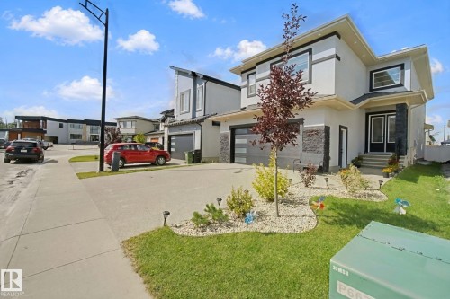 Contemporary exterior with stucco and stone accents - 4820 174 Avenue Nw, Edmonton, AB - Outdoor