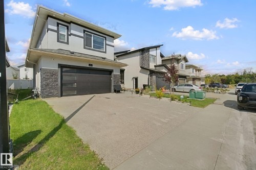 Contemporary exterior with stone accenting and a concrete driveway - 4820 174 Avenue Nw, Edmonton, AB - Outdoor