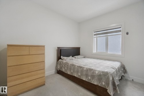 Recessed window with roller shades - 4820 174 Avenue Nw, Edmonton, AB - Indoor Photo Showing Bedroom