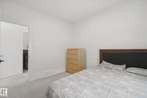 Wall-to-wall carpeting with light-colored walls and ceiling - 4820 174 Avenue Nw, Edmonton, AB - Indoor Photo Showing Bedroom