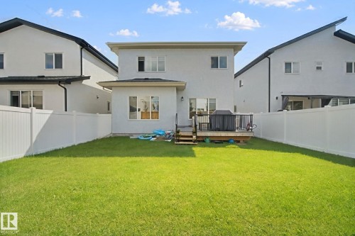 Expansive grassy yard with white privacy fencing - 4820 174 Avenue Nw, Edmonton, AB - Outdoor With Deck Patio Veranda