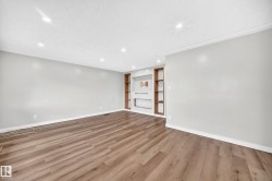 Recessed lighting, crown molding, wood-finish flooring, and built-in shelving - 