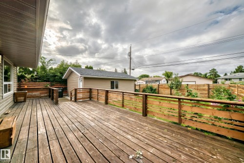 Expansive wooden deck with slatted wood railings - 7603 130 Avenue Nw, Edmonton, AB - Outdoor With Deck Patio Veranda With Exterior