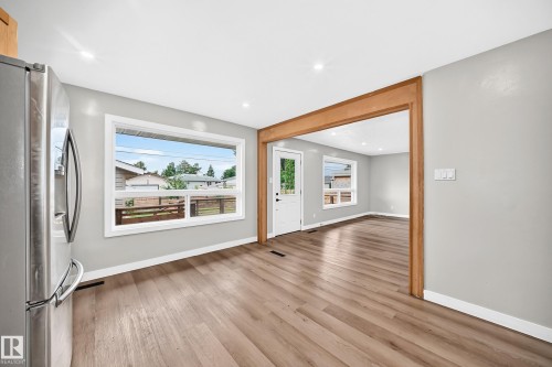 Recessed lighting, wood-finish flooring, white trim, wood-framed entryway, and a white door with glass paneling - 7603 130 Avenue Nw, Edmonton, AB - Indoor