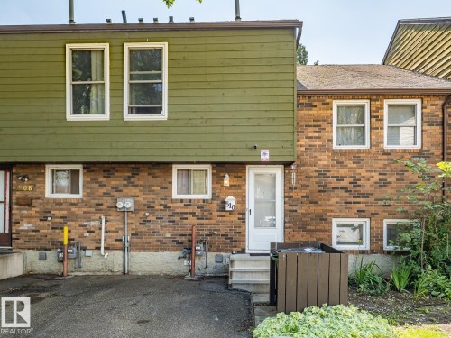 Brick and siding exterior with multiple windows - #No 510 Abbottsfield Rd Nw Nw, Edmonton, AB - Outdoor With Exterior