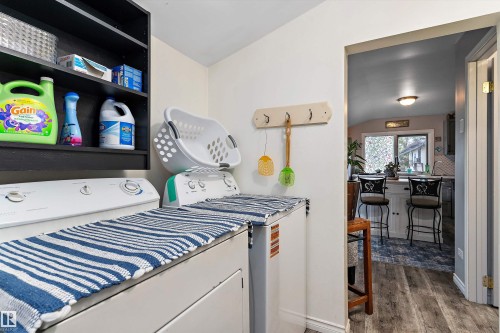 Laundry area featuring a built-in shelving unit and a wall-mounted coat rack - 5404 45 Avenue, Wetaskiwin, AB - Indoor Photo Showing Laundry Room