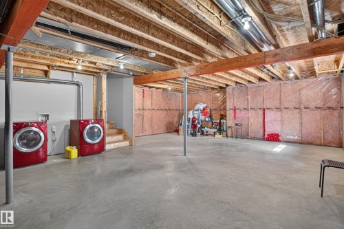 Unfinished basement featuring exposed wood joists, concrete flooring, and insulated perimeter walls - 9515 221 Street Nw, Edmonton, AB - Indoor Photo Showing Basement
