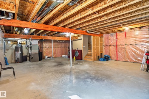 Spacious unfinished basement with exposed wood joists and concrete flooring - 9515 221 Street Nw, Edmonton, AB - Indoor Photo Showing Basement