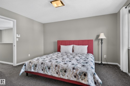 Recessed ceiling light fixture, grey wall paint, and grey carpet flooring - 9515 221 Street Nw, Edmonton, AB - Indoor Photo Showing Bedroom
