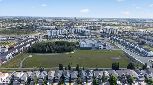 Expansive green spaces with paved pathways and surrounding residential developments - 9515 221 Street Nw, Edmonton, AB - Outdoor With View