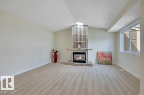 633 Willow Crest Nw, Edmonton, AB - Indoor Photo Showing Living Room With Fireplace