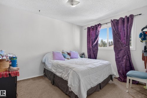 White wall finishes and carpeted flooring - 18247 93 Avenue Nw, Edmonton, AB - Indoor Photo Showing Bedroom