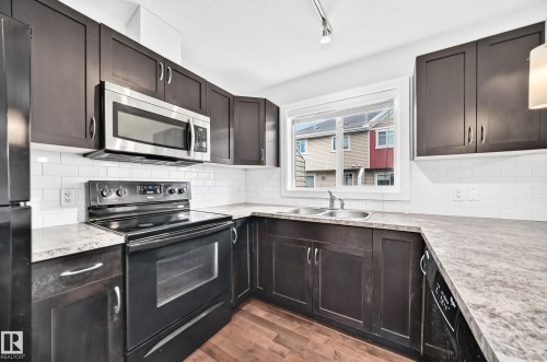 #73 9535 217 St Nw, Edmonton, AB - Indoor Photo Showing Kitchen With Double Sink