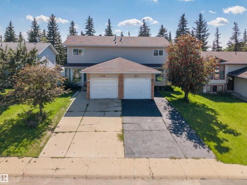 Two-story residence with a dual attached garage and a concrete driveway - 4609 38A Avenue Nw, Edmonton, AB - Outdoor With Facade