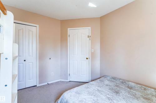 Wall-to-wall carpeting and neutral wall tones - 4609 38A Avenue Nw, Edmonton, AB - Indoor Photo Showing Bedroom