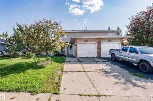 Two-story residence featuring a dual garage, brick accents, a gabled roofline, and a concrete driveway - 4609 38A Avenue Nw, Edmonton, AB - Outdoor