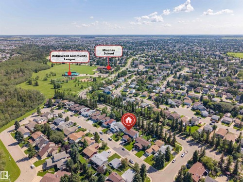 Aerial overview of a residential neighborhood with a prominent green space - 4609 38A Avenue Nw, Edmonton, AB - Outdoor With View