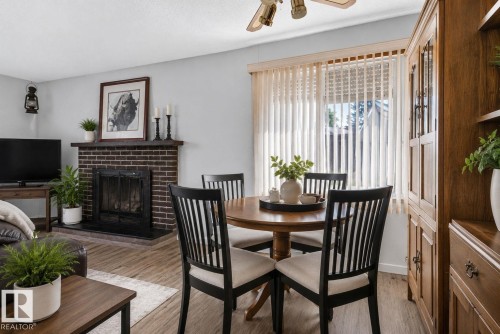 13050 32A Street Nw, Edmonton, AB - Indoor Photo Showing Dining Room With Fireplace