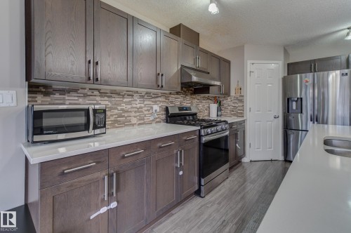 6706 24 Avenue Sw, Edmonton, AB - Indoor Photo Showing Kitchen With Stainless Steel Kitchen With Double Sink With Upgraded Kitchen