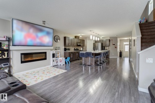 6706 24 Avenue Sw, Edmonton, AB - Indoor Photo Showing Living Room With Fireplace