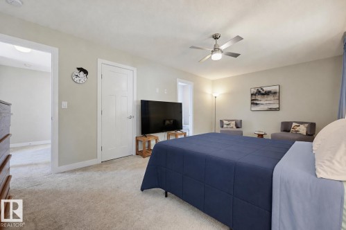 Carpeted room with neutral wall tones - 12219 93 Street Nw, Edmonton, AB - Indoor Photo Showing Bedroom