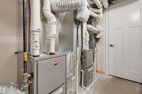 Dual Lennox heating and cooling systems with associated ductwork and piping - 12219 93 Street Nw, Edmonton, AB - Indoor Photo Showing Basement
