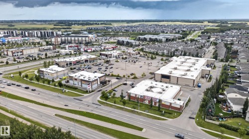 Expansive commercial properties with ample surface parking, surrounded by residential developments and major roadways - 3755 20 Street Nw, Edmonton, AB - Outdoor With View