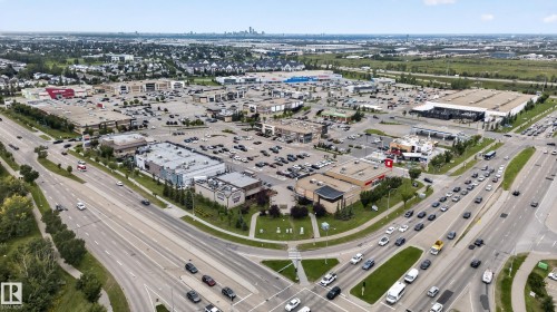 Expansive commercial district featuring multiple retail establishments and a large parking area - 3755 20 Street Nw, Edmonton, AB - Outdoor With View