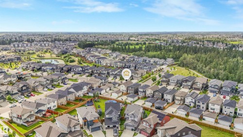 Expansive residential development featuring varied architectural styles and mature trees - 203 Cavanagh Common Sw, Edmonton, AB - Outdoor With View