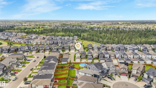 Aerial perspective showcasing a residential neighborhood with varied architectural styles - 203 Cavanagh Common Sw, Edmonton, AB - Outdoor With View