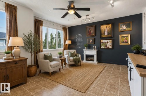 Spacious room featuring tile flooring, a dark accent wall, and a built-in electric fireplace with white mantel - 22 Voleta Crest, Spruce Grove, AB - Indoor With Fireplace