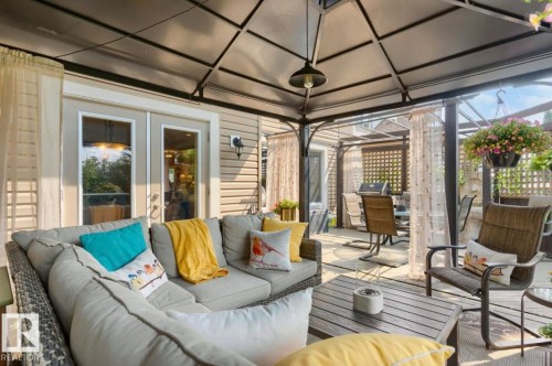 Spacious outdoor living area with a dark-framed gazebo structure - 22 Voleta Crest, Spruce Grove, AB - Outdoor With Deck Patio Veranda
