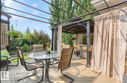 Expansive wooden deck featuring multiple defined outdoor zones - 22 Voleta Crest, Spruce Grove, AB - Outdoor With Deck Patio Veranda With Exterior