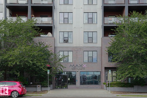 Modern facade featuring brick and metal paneling - #607 10518 113 St Nw Nw, Edmonton, AB - Outdoor With Balcony