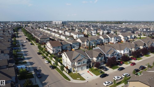 Corner lot property featuring a two-story residence with an attached garage and a concrete driveway - 7791 Eifert Crescent Nw, Edmonton, AB -  With View