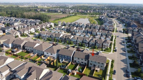 Aerial perspective showcasing a residential development with multiple detached and semi-detached homes - 7791 Eifert Crescent Nw, Edmonton, AB - Outdoor With View