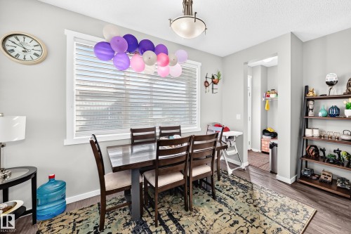 Wood-finish flooring throughout - 1929 24 Street Nw, Edmonton, AB - Indoor Photo Showing Dining Room